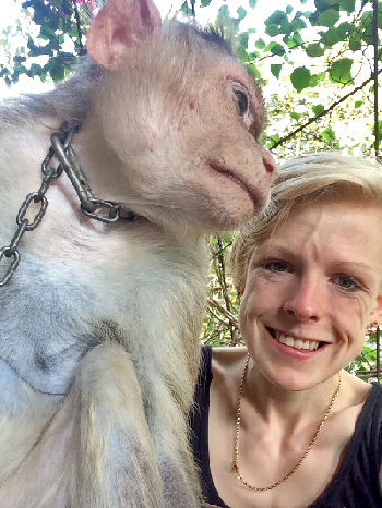 volunteer with monkey